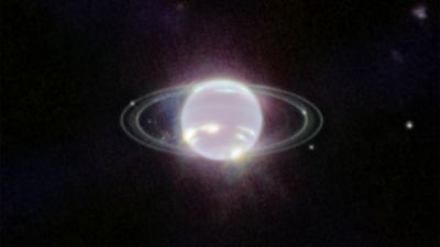 JWST NIRCam image of Neptune showing its rings and several inner moons illuminated in near-infrared light.