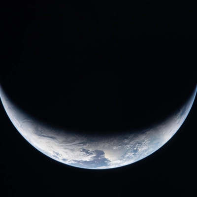 art002e009166 (April 3, 2026) - A sliver of Earth is illuminated against the blackness of space in this photo taken...