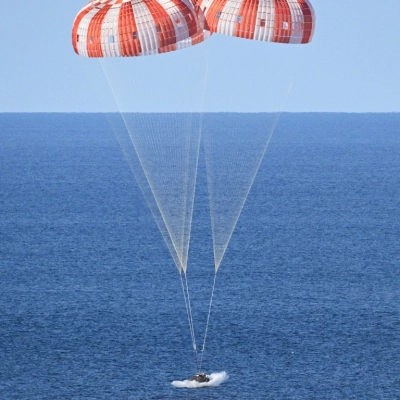 NASA's Orion spacecraft carrying Artemis II Commander Reid Wiseman, Pilot Victor Glover, and Mission Specialist Christina Koch from NASA, along...