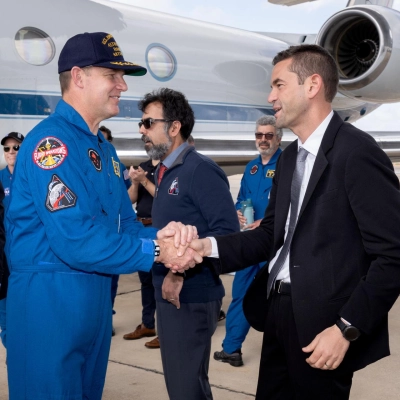 NASA Administrator Jared Isaacman greets Artemis II Mission Specialist Jeremy Hansen at the Artemis II crew’s return home to Houston...