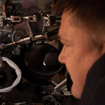 art002e009272 (April 6, 2026) - Artemis II mission specialist and CSA (Canadian Space Agency) astronaut Jeremy Hansen peers out one...