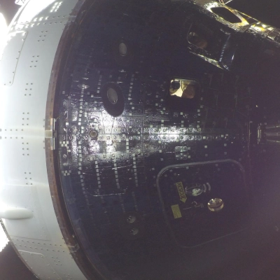 art002e009013 (April 42026) - Artemis II Mission Specialist Christina Koch is seen through a window of the Orion spacecraft...