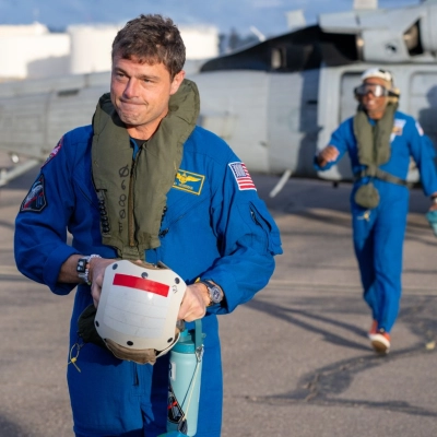 Artemis II NASA astronaut Reid Wiseman, commander, and Victor Glover, pilot, are seen after being flown from USS John P....
