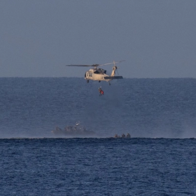 A Navy MH-60 Seahawk from Helicopter Sea Combat Squadron (HSC) 23 is seen as it lifts CSA (Canadian Space Agency)...