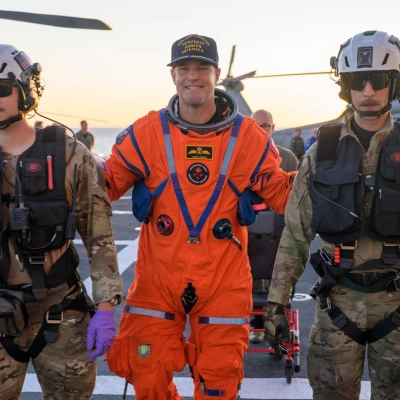 CSA (Canadian Space Agency) astronaut Jeremy Hansen, Artemis II mission specialist is assisted off the flight deck after arriving aboard...