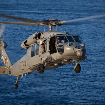 A Navy MH-60 Seahawk from Helicopter Sea Combat Squadron (HSC) 23 with NASA astronaut Reid Wiseman, Artemis II commander and...