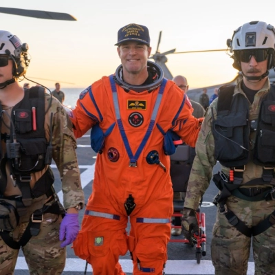 CSA (Canadian Space Agency) astronaut Jeremy Hansen, Artemis II mission specialist is assisted off the flight deck after arriving aboard...