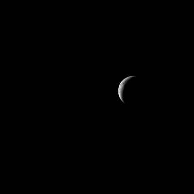 art002e016354 (April 8, 2026) The Artemis II crew captures a thin lunar crescent as they travel back to Earth.