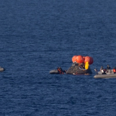 NASA’s Orion spacecraft is seen as recovery teams work to secure the spacecraft ahead of transferring Artemis II crewmembers NASA...