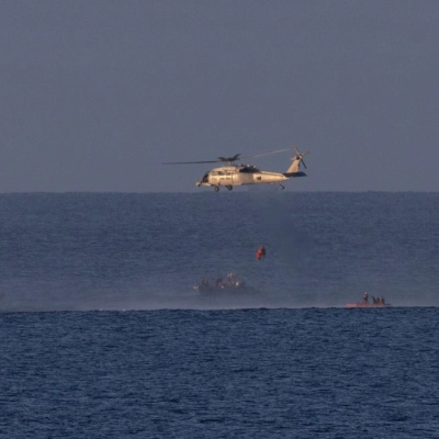 A Navy MH-60 Seahawk from Helicopter Sea Combat Squadron (HSC) 23 is seen as it lifts NASA astronaut Victor Glover,...