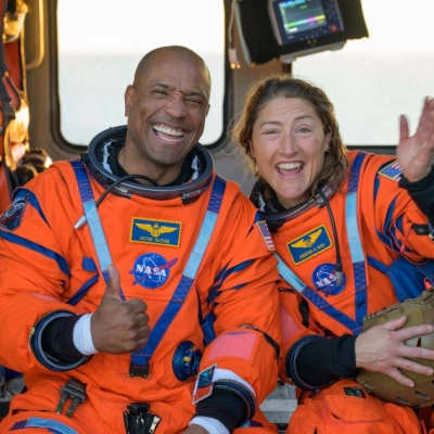 NASA astronaut Victor Glover, Artemis II pilot, left, and NASA astronaut Christina Koch, Artemis II mission specialist are seen sitting...