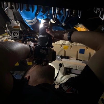 art002e009295 (April 6, 2026) – Astronaut Jeremy Hansen captures an image through the camera shroud covering window 2 of the...