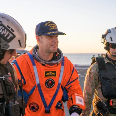 CSA (Canadian Space Agency) astronaut Jeremy Hansen, Artemis II mission specialist is assisted off the flight deck after arriving aboard...