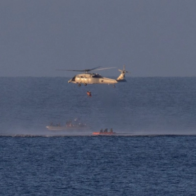 A Navy MH-60 Seahawk from Helicopter Sea Combat Squadron (HSC) 23 is seen as it lifts NASA astronaut Reid Wiseman,...