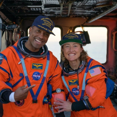 NASA astronaut Victor Glover, Artemis II pilot, left, and NASA astronaut Christina Koch, Artemis II mission specialist are seen sitting...