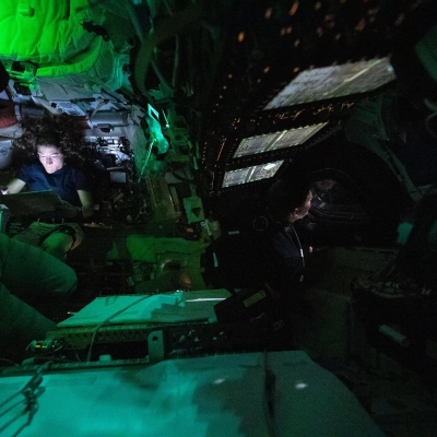 art002e004440 (April 3, 2026) - NASA astronaut Christina Koch is illuminated by a screen inside the darkened Orion spacecraft on...