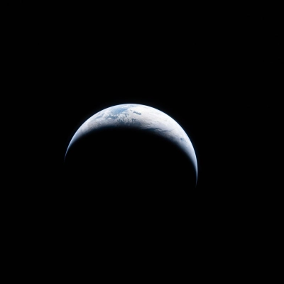 art002e004450 (April 4, 2026) - Earth is illuminated against the blackness of space in this photo taken by an Artemis...