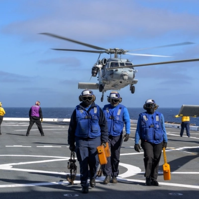 U.S. Navy MH-60 Seahawks from Helicopter Sea Combat Squadron (HSC) 23 depart USS John P. Murtha as they conduct air...