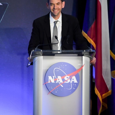 jsc2026e022287 (April 11, 2026) – NASA Administrator Jared Isaacman, addresses a crowd of friends, family, and colleagues assembled for the...