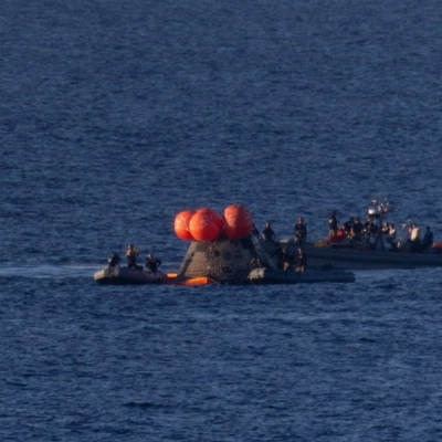 NASA’s Orion spacecraft is seen as recovery teams work to secure the spacecraft ahead of transferring Artemis II crewmembers NASA...