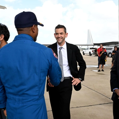 NASA Administrator Jared Isaacman greets Artemis II Pilot Victor Glover at the Artemis II crew’s return home to Houston on...