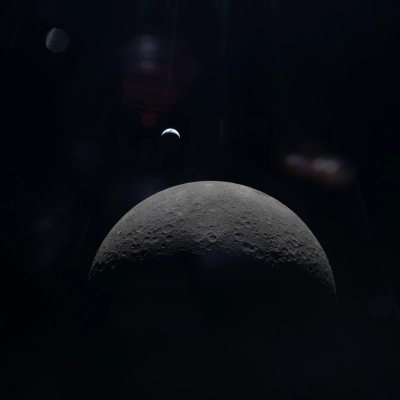 art002e015231 (April 6, 2026) – The Artemis II crew captures a faint view of a crescent Earth above the horizon...