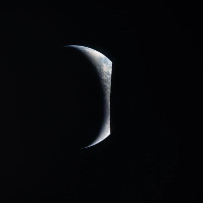 art002e009280 (April 6, 2026) – Earthrise captured through the Orion spacecraft window at 7:22 p.m. ET during the Artemis II...
