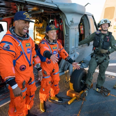 NASA astronaut Victor Glover, Artemis II pilot, left, and NASA astronaut Christina Koch, Artemis II mission specialist are seen sitting...